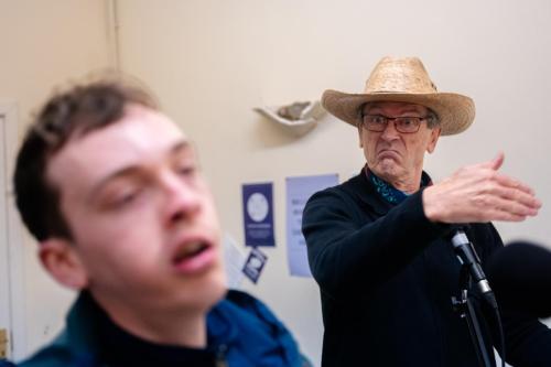 Matthew Zajac in rehearsals, wearing a cowboy hat and looking angry.